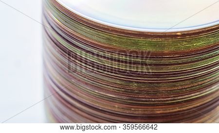 Lot Of Old Cds Stacked On The Windowsill