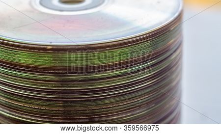 Lot Of Old Cds Stacked On The Windowsill