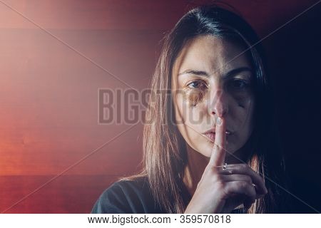 Attractive Young Girl, Abused, Putting Her Finger In Her Mouth And Doing The Gesture To Be Quiet