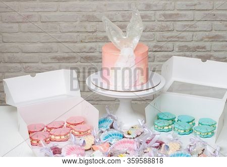 Mermaid Theme Candy Bar With Cake, Cupcakes, Macaroons And Biscuits. Sea Shell Shaped Macaroons With