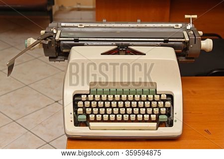 Mechanical Typewriter Machine At Desk In Retro Office