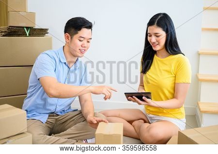 Wfh: Thai Entrepreneur Couple Are Packing The Box. Selling Online And Home Delivery. Teamwork For St