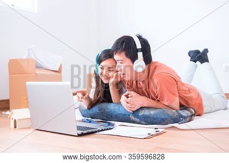 Wfh: Caucasian Asian Love Couple Work From Home During The Coronavirus Crisis. Social Distancing And