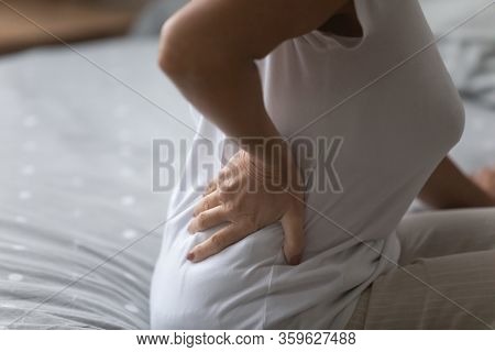 Mature Senior Grandmother Suffering From Arthritis Radiculitis.
