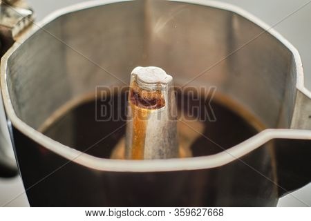 Making Tasty Black Coffee In Metal Moka Pot On Electric Cooker Close Up Detail