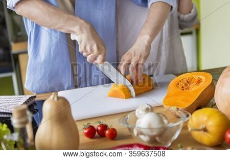 Healthy Nutrition Concept. Couple Cooking Dinner From Fresh Tomatoes And Pumpkin, Stay At Home, Copy