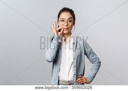 People, Emotions And Lifestyle Concept. Serious-looking Asian Girlfriend Making Promise To Keep Sile