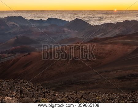 Beautiful Sunset Along A Rocky Beach With Big Waves