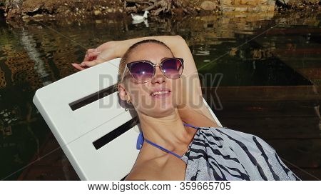 Woman Shooting Self Portrait. Take Photo And Video On Smartphone. Girl Rest, Relax, Walk In Sunglass