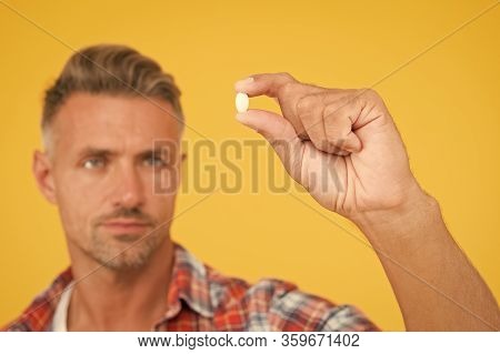 Vitamin Pill In Hand. Side Effects. Medicines Concept. Hemp Derived Cbd. Food Additives Vitamins For
