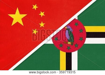 China Or Prc Vs Dominica National Flag From Textile. Relationship Between Asian And American Countri
