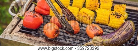 Man With Tongs Cooking On A Back Yard Barbecue Banner, Long Format