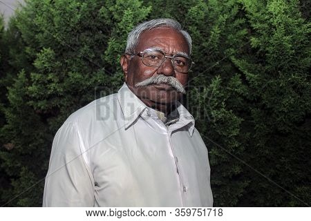 Kolhapur, Maharashtra/ India- December 12th 2019; Old Indian Man Having White Mustache And Glasses P