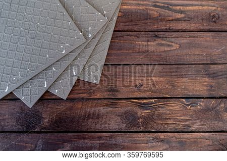 Ceramic Tile Close-up On A Wooden Background