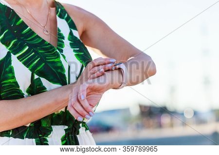 Female Touching Her Smartwatch. Detail View Tech Gear.