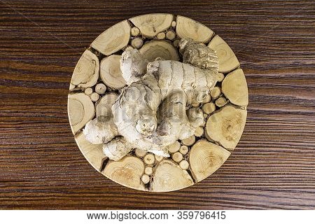 Fresh Ginger Root On Wooden Table Background, Antivir. Naturally Elevating Your Energy Levels, Close