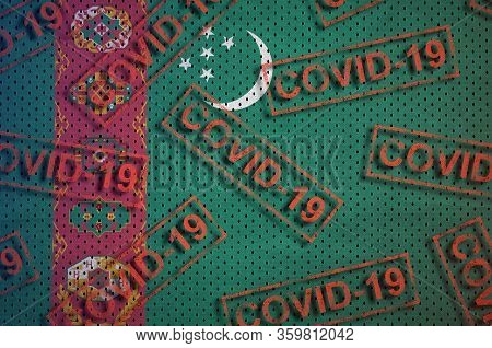 Turkmenistan Flag And Many Red Covid-19 Stamps. Coronavirus Or 2019-ncov Virus Concept