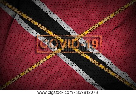 Trinidad And Tobago Flag And Covid-19 Stamp With Orange Quarantine Border Tape Cross. Coronavirus Or