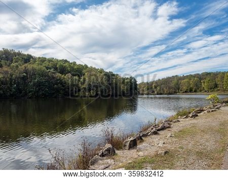 Twin Lakes In The Laurel Highlands Of Pennsylvania.  Water With A Trail Along The Side, A Green Tree