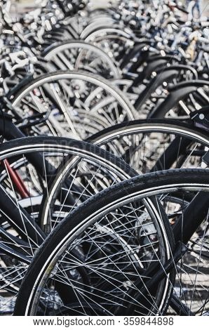 Detail Of The Wheels Of Parked Bikes In Venlo, Netherlands. Some Of The Blurred, Selective Focus. Cl