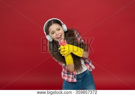 Cleaning Party. Girl Wear Headphones And Protective Gloves For Cleaning. Listening Music And Cleanin