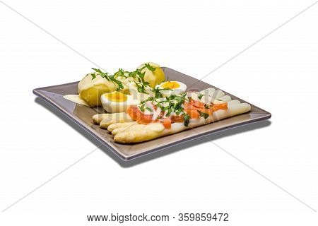 Delicious Seasonal White Asparagus With Creamy Hollandaise Sauce, Baby Boiled Potatoes And Sliced Sm