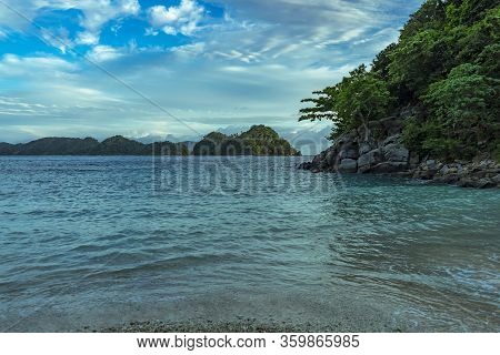 Undiscovered Pristine Beach Hidden In The Jungle Overviewing Islands Off Shore. Nice Ocean Water And