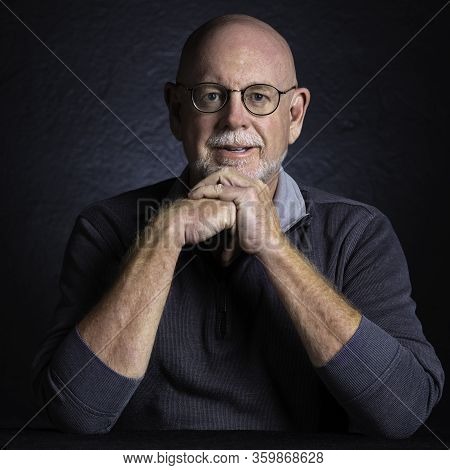 Artistic Studio Portrait Headshop Of A Cheeerful Senior In Color
