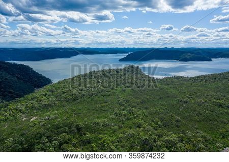 Aerial View Of Hills, Forest And River