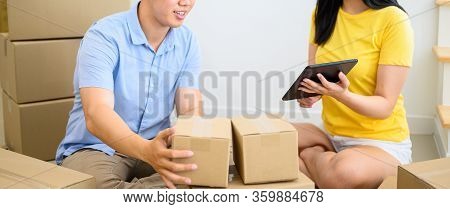 Wfh: Thai Entrepreneur Couple Are Packing The Box. Selling Online And Home Delivery. Teamwork For St