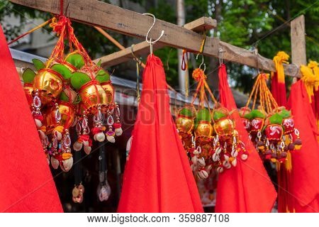Small Golden Copper Buckets With Auspicions Hindu Red Symbols On Them, Leaves, Coconuts With Worship