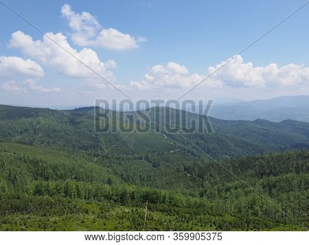 Panorama Of Beskids Mountains Land Near Salmopol Pass View Above European City Of Szczyrk In Poland,