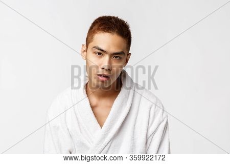 Beauty, Spa And Leisure Concept. So Lame. Portrait Of Reluctant And Indifferent Asian Man In Bathrob