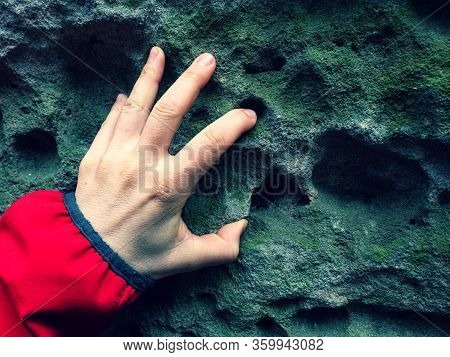 Female Finger Touch Holes In Sandstone Rock. Holes Called Honeycomb According Their Shapes.
