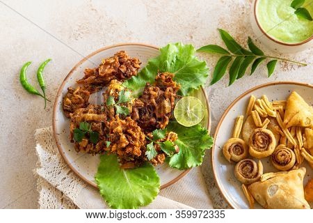 Indian Cuisine Indian Food. Pakora Traditional Indian Deep-fried Snack. Pakoras On Black Plate With 