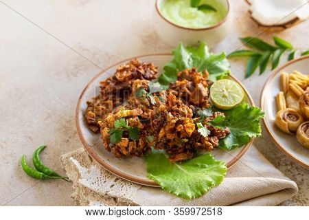 Indian Cuisine Indian Food. Pakora Traditional Indian Deep-fried Snack. Pakoras On Black Plate With 