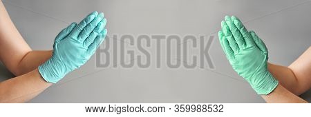 Hands Clasped In Blue Glove. Healthcare Clean