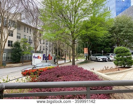 Atlanta, Ga/usa-3/21/20:  A Fedex Truck Delivering Package To Condominiums And Corporate Buildings I
