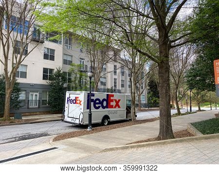 Atlanta, Ga/usa-3/21/20:  A Fedex Truck Delivering Package To Condominiums And Corporate Buildings I