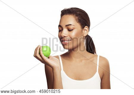 Cute Young Woman With Beautiful Smile Holding Green Apple. Healthy Lifestyle, Nutrition, Dieting, We