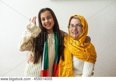 Arab Mother With Her Daughter On White Background