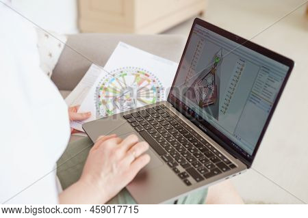 Tver, Russia-august 7, 2022. A Woman With A Laptop Is Studying Human Design. The Concept Of Studying
