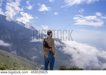 Llogara Albania - 12.07.2021: Silhuette Of A Man Standing And Looking To The Sea. Nature And Beauty 