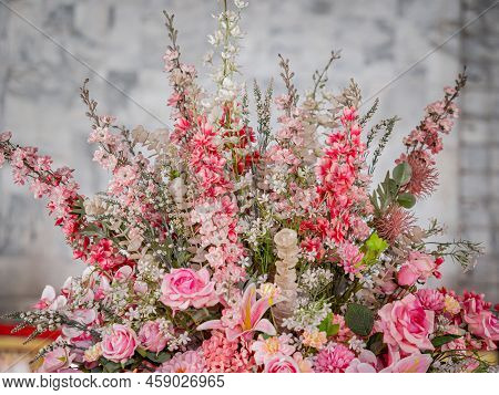 Big Bouquet Of Flowers In A Vase On A Gray Wall Background