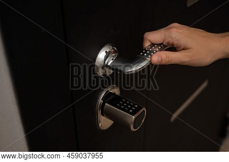 Woman Opens The Combination Lock On The Door To The Apartment. Keyless Entry.