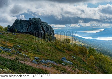 Big Boulder Rock On A Top Of A Mountain Ridge With Vast Valley Bellow. Hiking In Arctic Wilderness O