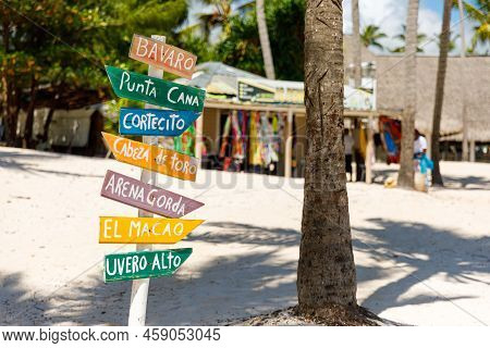 Dominican Republic Bavaro Punta Cana Provinces La Altagracia. Wooden Pillar With Signposts Direction