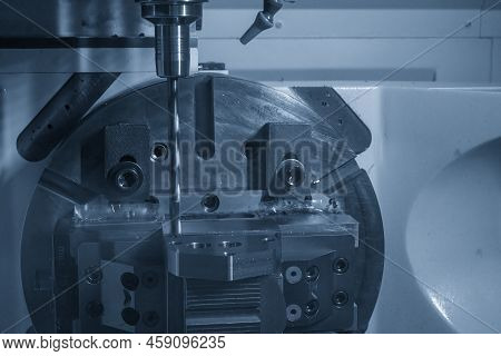 The 5-axis Cnc Milling Machine  Hole Cutting On The Metal Mold Part. The Hi-technology Injection Mol