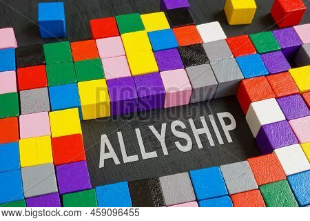 Word Allyship And Colorful Cubes On The Dark Surface.