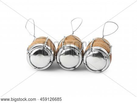 Sparkling Wine Corks With Muselet Caps On White Background